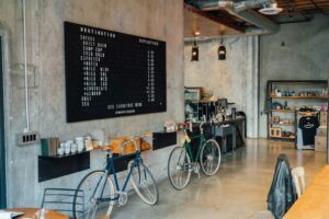 Two Bikes Parked Beside Wall Inside Room