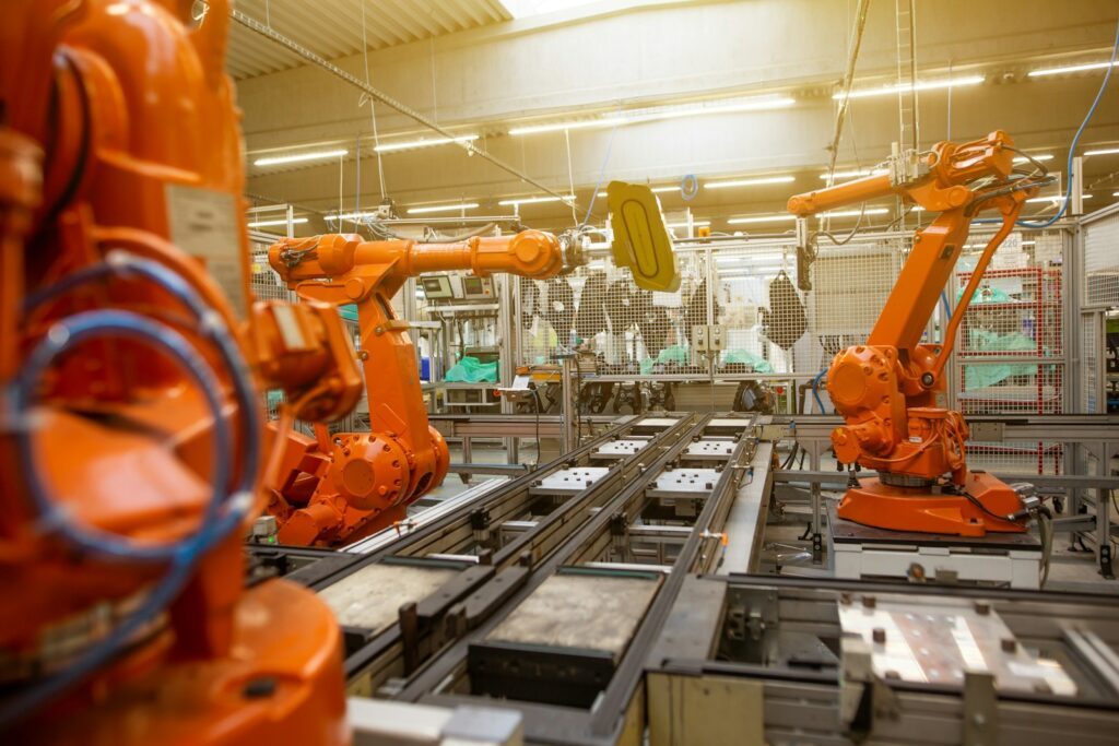 Custom Ai Agent Development 2 A Factory Filled With Lots Of Orange Machines